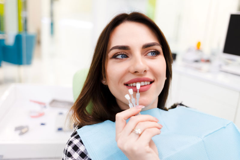 dental-patient-receiving-teeth-whitening-treatment-using-dental-veneers